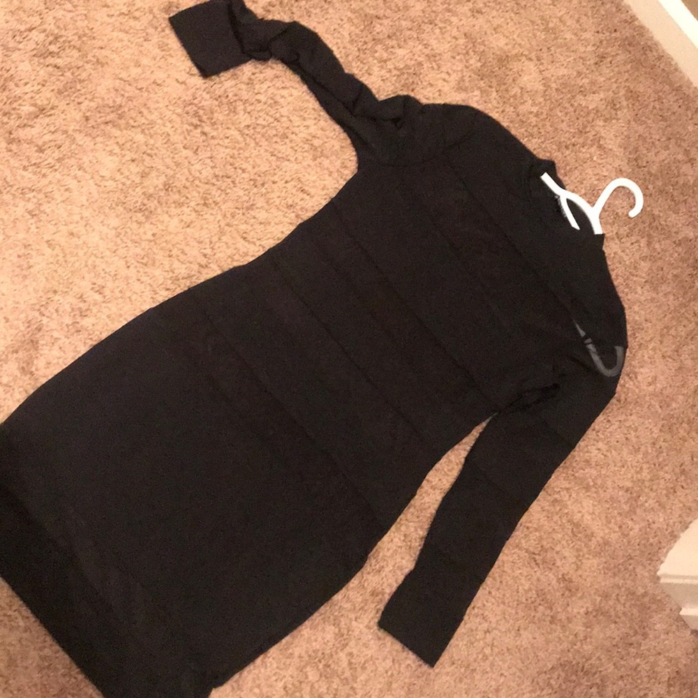 Black striped dress with sheer stripes.